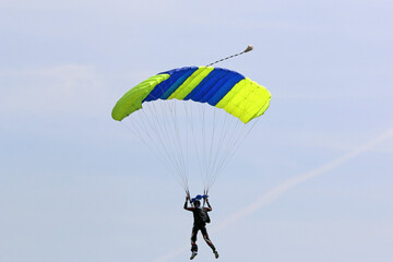 Skydiver in a blue sky	