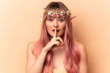 Young elf woman with pink hair isolated on beige background keeping a secret or asking for silence.