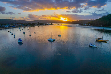 Aerial sunrise waterscape with boats