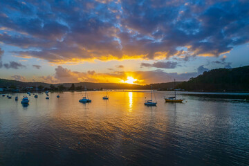 Aerial sunrise waterscape with boats