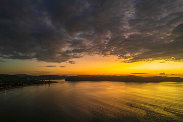 Aerial sunrise seascape with  low clouds