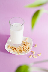 Vegetarian cashew nut milk pink vertical background