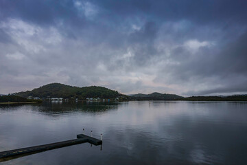 Rainy day sunrise by the bay