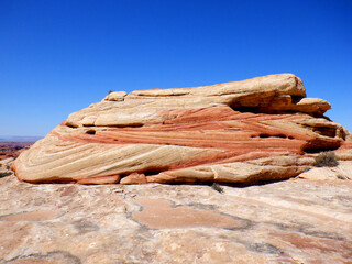 Desert promontory with wind eroded stratification in the Bears Ears wilderness area of Southern Utah.  