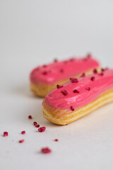Pink eclair with sublimated raspberries