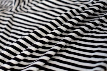 Black and white stripes fabric cloth abstract background, close-up