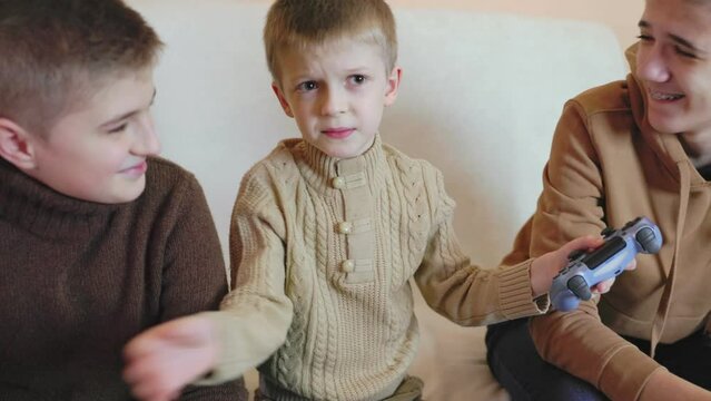 children playing on the console with joysticks in ruhs close-up