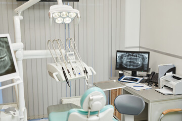 Background image of dental clinic with modern equipment and teeth x-ray, copy space