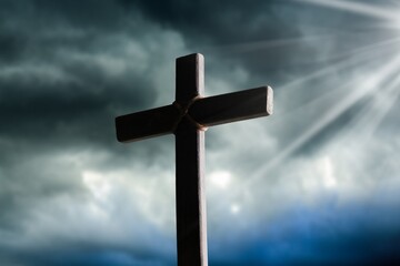 Dramatic religious church cross framed against a moody sky