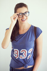Fototapeta premium Gorgeously geeky. Portrait of an attractive young woman wearing glasses.