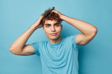 kinky guy in blue t-shirts with a pumped-up body isolated background