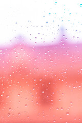 Rain drops on pink background