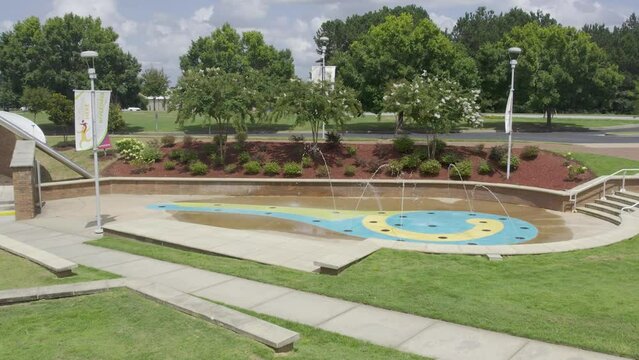 Fly over a water fountain to landscape view
