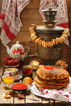 Pancakes with red caviar and tea. Pancake week
