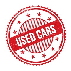USED CARS text written on red grungy round stamp.