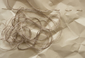 thread on crumpled paper and baste stitch