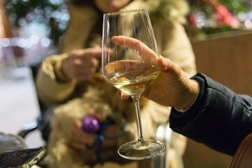 Woman's hand holding a glass cup in her hand