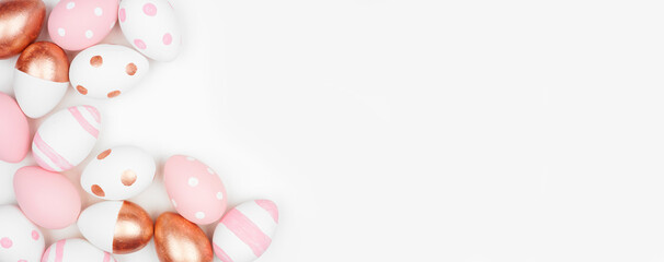 Easter egg corner border. Rose gold, pastel pink and white colors on a white background. Copy space.
