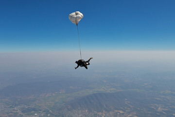 Naklejka na ściany i meble Skydiving. Tandem jump. Tandem is in the sky.