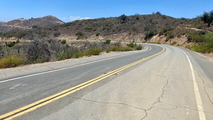 County Sign Route N9, highway winds through the Santa Monica Mountains, seen on a clear afternoon from part of the Backbone Trail in national recreation area