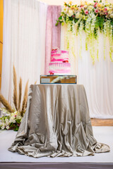 Beautiful pink wedding cake decorated with strawberries
