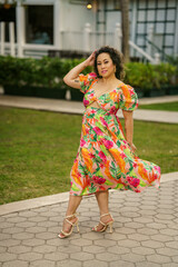 Her dresss is blowing in the wind
