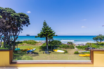 View from the backyard of a bach in Whangamata beach in New Zealand