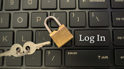 Top view of word - Log In on laptop with padlock background.