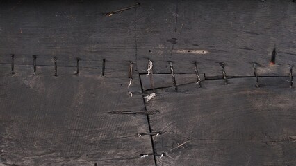 Obraz na płótnie Canvas black wooden texture with stitch pattern, background image