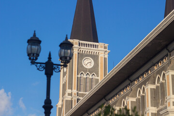 Fototapeta na wymiar Church tower,church with clock and blue sky.