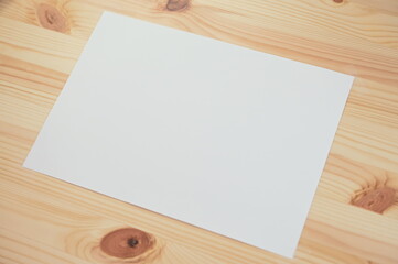 white paper on wood table