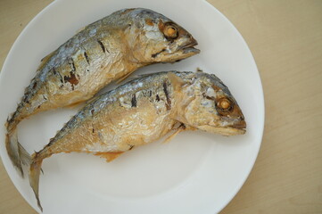 fried fish on white plate