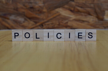 policies text on wooden square, business and motivation quotes