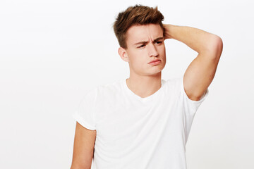 Obraz premium Natural handsome qualities. Studio portrait of a young man with his arm up and a serious expression.