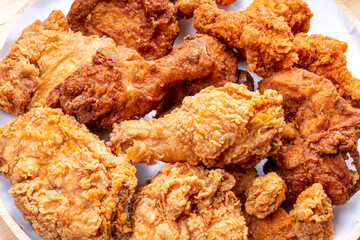 Fried chicken in woode plate on wooden background, Fried chicken on wooden background.