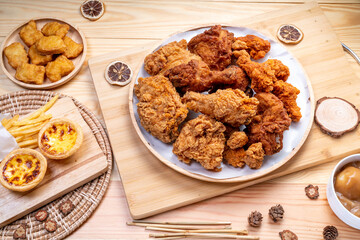 Fried chicken in woode plate on wooden background, Fried chicken on wooden background.