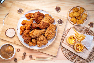 Fried chicken in woode plate on wooden background, Fried chicken on wooden background.