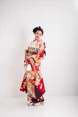 Obraz na płótnie Canvas 振袖を着た日本髪の女性　Japan
