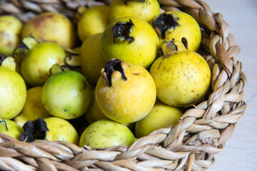 yellow araçá inside a basket