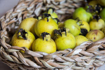 yellow araçá inside a basket