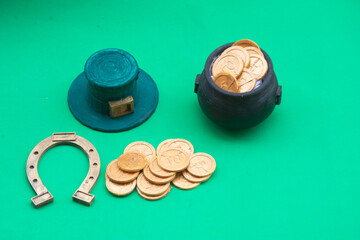 St. Patrick's day background with coins and leprechauns hat
