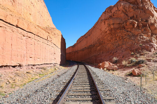 Train tracks through carved stone canyon in Moab