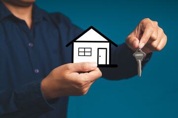 Mortgage and Investment property. Real estate agent with house model and keys