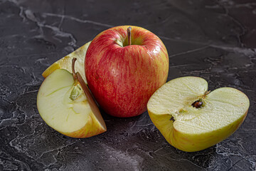 Fresh red and yellow apples, whole and in slices, healthy fruits