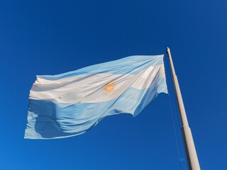 Flag of Argentina isolated on blue sky - 489990711