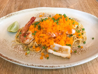stir-fried angle hair spaghetti with seafood and shrimp egg