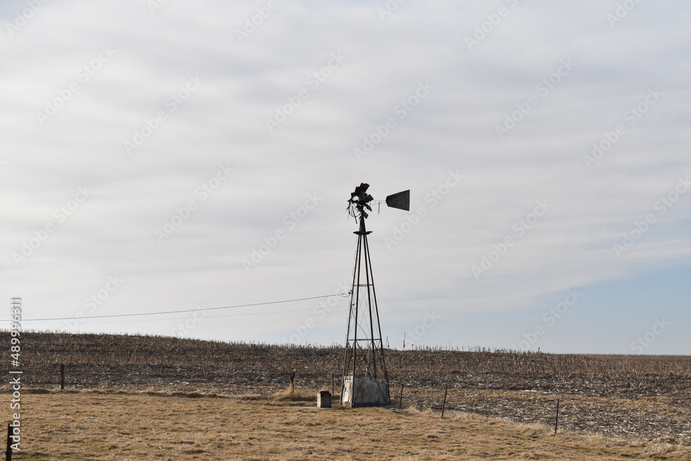 Poster windmill in a farm field