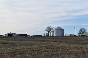 Grain Bins in a Farm Field