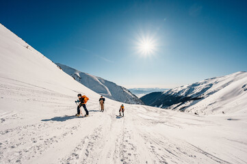 Ziarska dolina, slovakia, 10.2.2022. Mountaineer backcountry ski walking ski alpinist in the mountains. Ski touring in alpine landscape with snowy trees. Adventure winter sport. © Zedspider