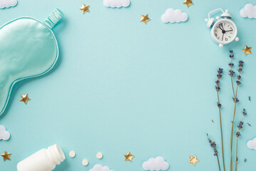 Top view photo of blue satin sleeping mask sprig of lavender alarm clock open bottle with pills clouds and golden stars on isolated pastel blue background with blank space in the middle